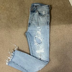 Distressed light wash jeans